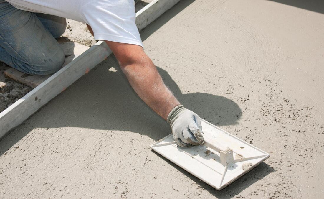worker flattening the cement